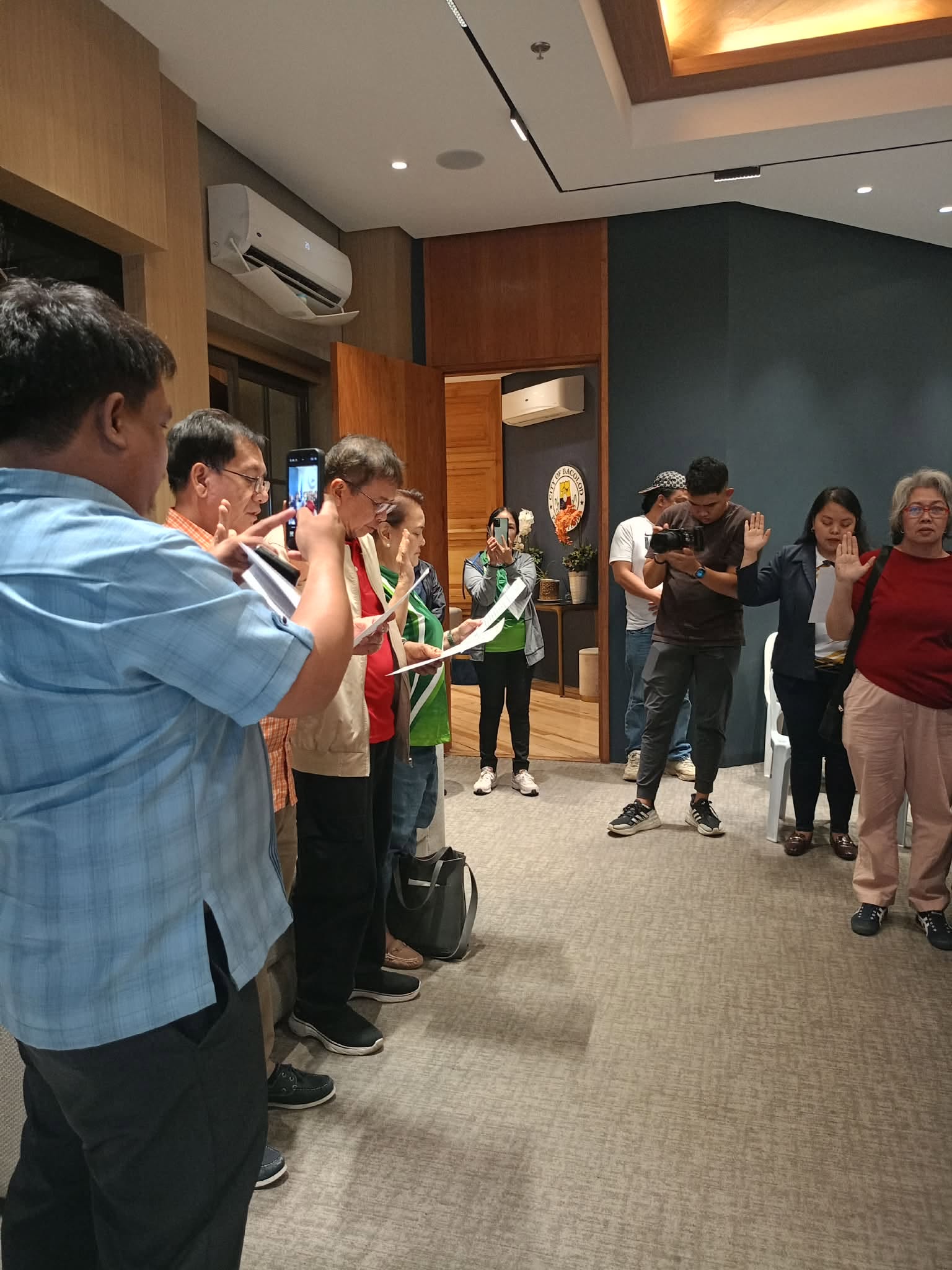 Cooperative executives and committee members solemnly reciting their oath